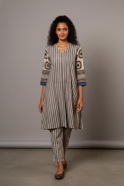 Embrace effortless sophistication with this contemporary striped kurta set